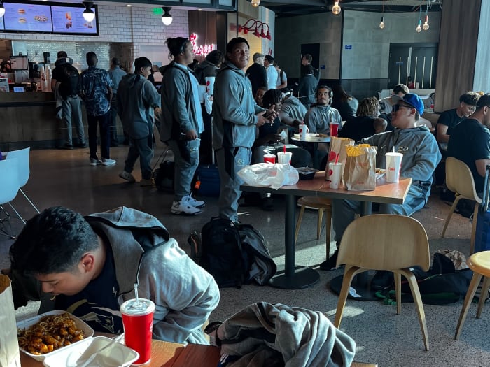 Birmingham football players eating at the airport before taking off to play in Texas Friday night.
